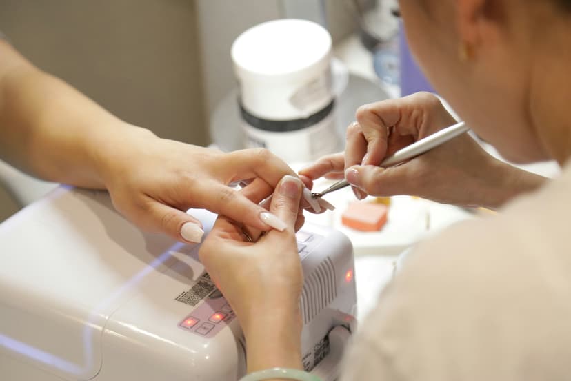 Nail technician working on manicure